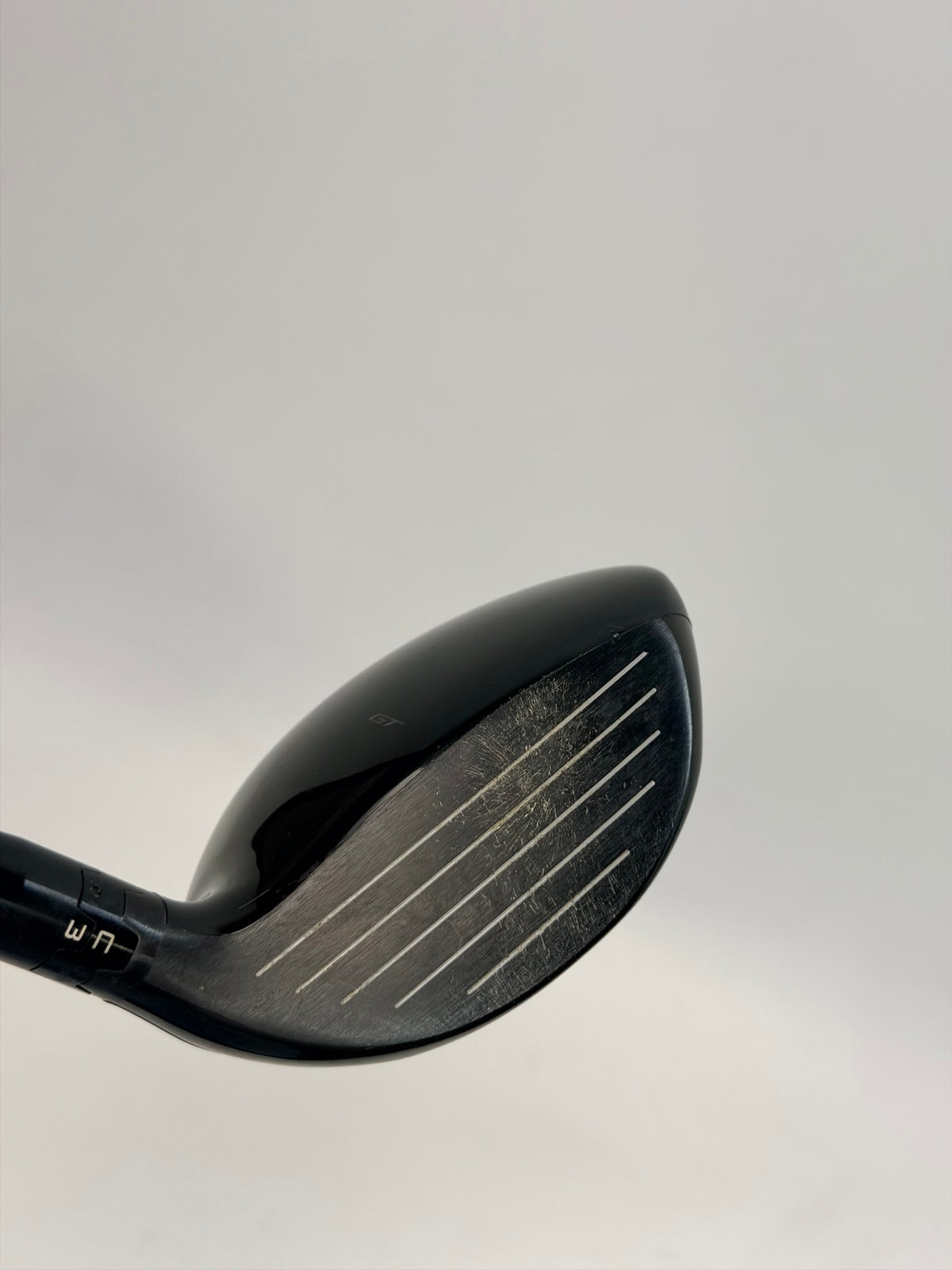 Titleist GT2 left-handed 7 wood clubface showing used condition