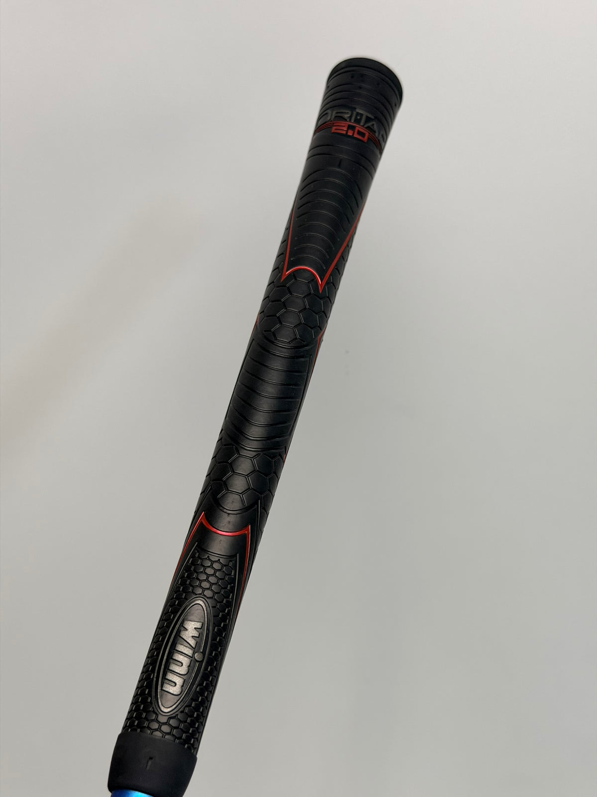 Black and red Winn Dri-Tac 2.0 grip